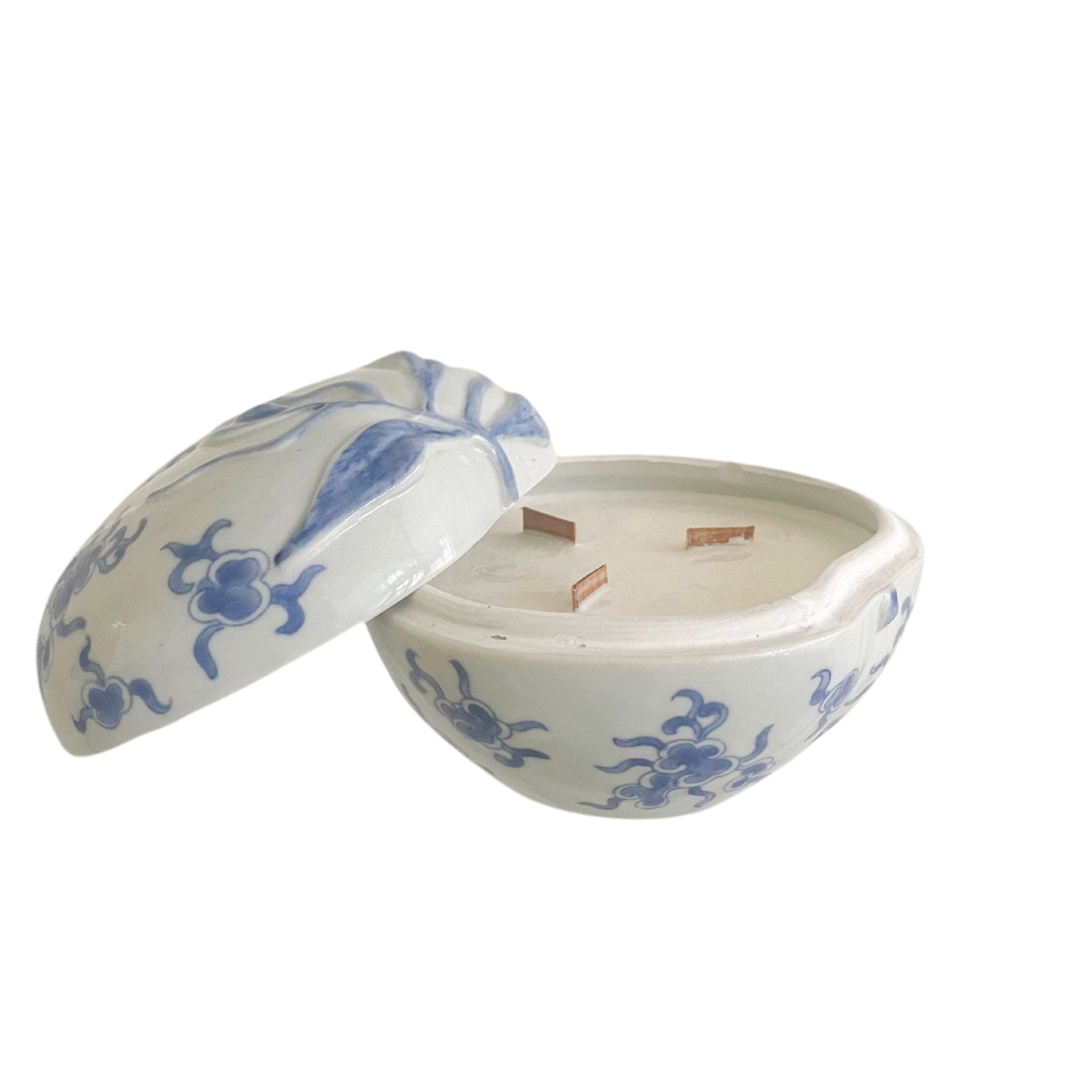 White ceramic container with blue floral patterns on a white background