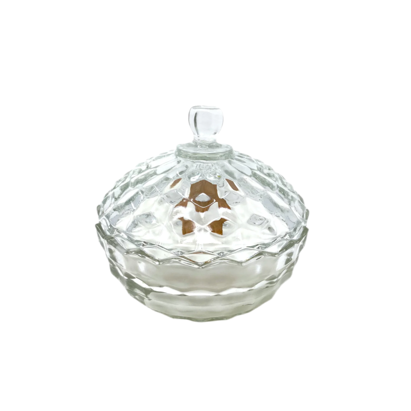 Clear glass candy dish with lid on a white background