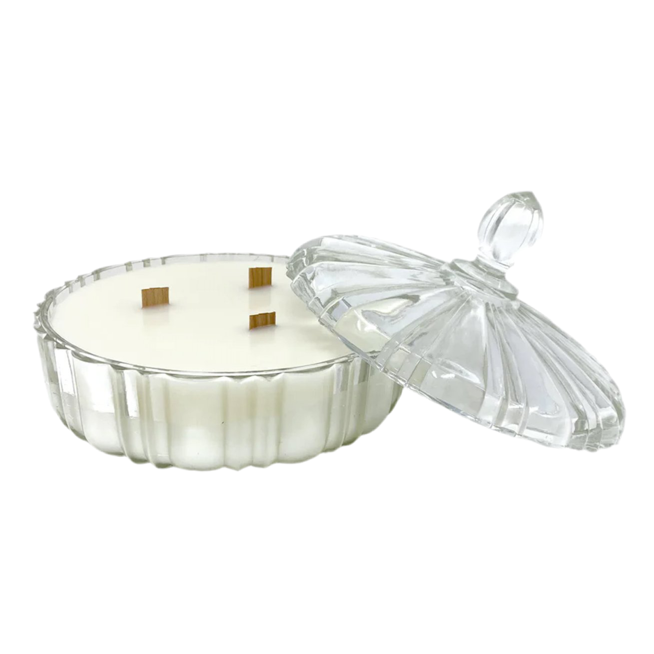White candle in a glass container with a clear lid on a white background