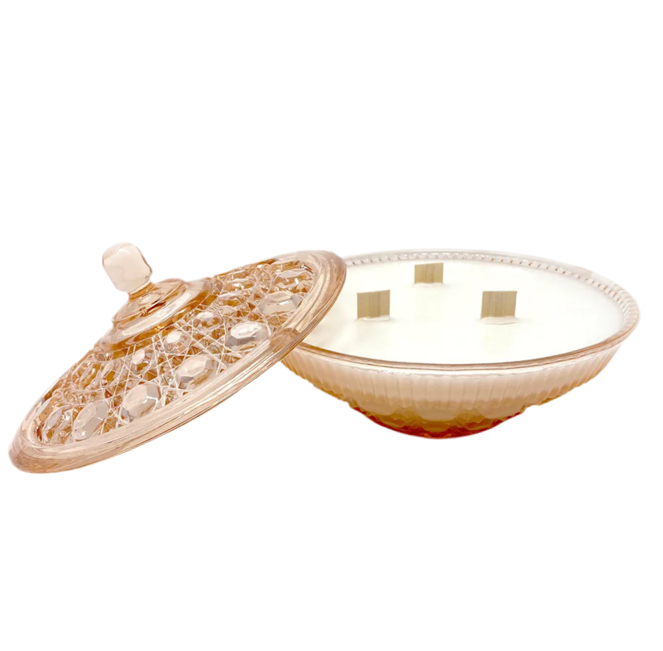 Decorative pink candle with a textured lid on a white background